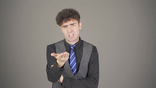 Man Gesturing and Speaking