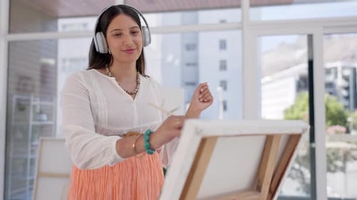 Music, painter dancing or happy woman painting on canvas in art gallery