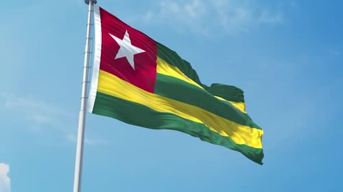 Realistic Togo National Flag Waving Against Blue Sky
