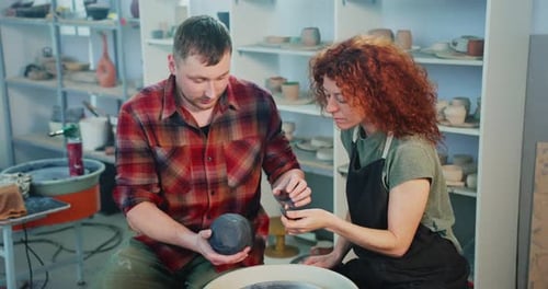 Pottery Creation with Man and Woman in Studio