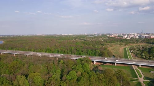 Car Traffic on Bridge Against City Landscape Aerial View