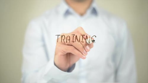 Training Man Writing on Transparent Screen