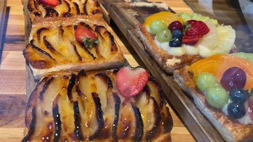 Fruit pastries displayed on wooden boards