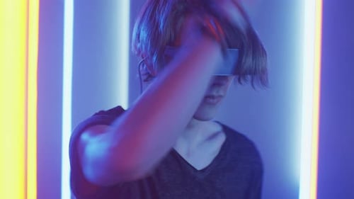 Young man immersed in virtual reality with headset