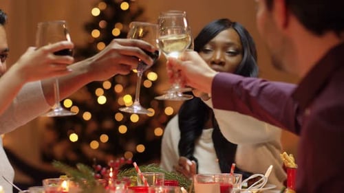 Group of friends raising glasses in festive toast
