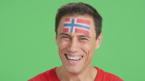 Smiling Man with Flag Painted on Forehead