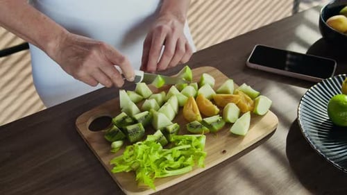 Cutting Fruit for a Healthy Snack at Home