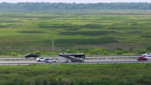 Motorhome Camper Recreational Vehicle Driving on American Freeway at High Speed USA Travel