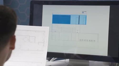 Male architect working in office.