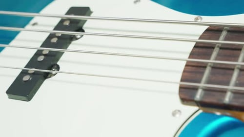 Close Up of Blue Electric Bass Guitar