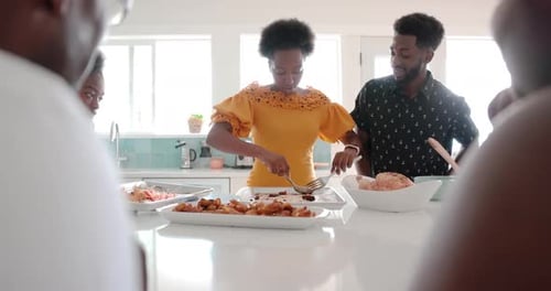 Multigenerational Family Preparing and Serving Dinner at Kitchen Island 1617 Years