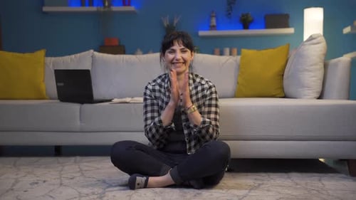 Woman Smiles and Gives Thumbs Up Indoors