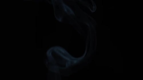Wispy Blue Smoke Rising on Black Background