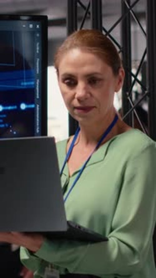 Vertical Video Female Entrepreneur Works with Neural Networks for Analytics