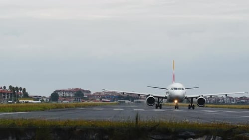 Airplane Taxiing on Airport Runway