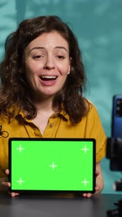 Vertical Video Upbeat Technology Specialist at Home Holding Newly Launched Green Screen Tablet