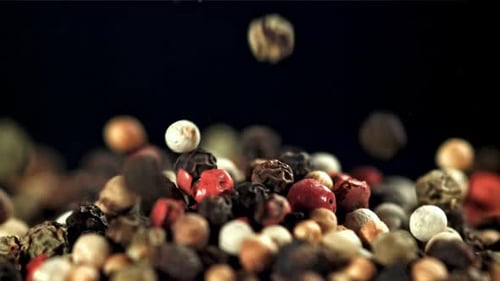 Colorful Peppercorns Falling in Slow Motion