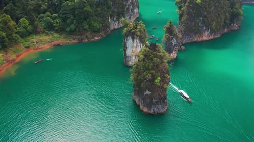Three limestone rocks Three Brothers at Cheow Lan Lake, Khao Sok National Park, Surat Thani Province