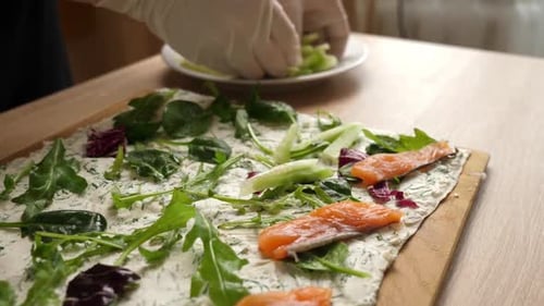 Food Preparation with Salmon and Greens Indoors