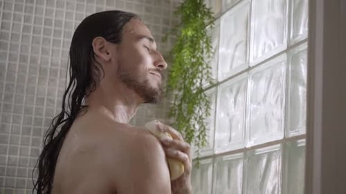 Adult Man Showering with Sponge and Soap