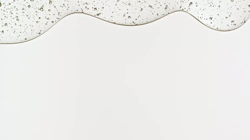 Transparent Cosmetic Gel Fluid With Molecule Bubbles and Oil Distribution on a White Background
