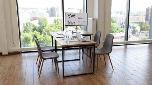 Modern Conference Room with Panoramic City View and Presentation Board