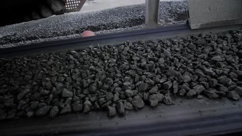 Gravel Ore on Moving Conveyor Belt at Rock Mining Quarry