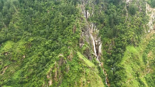 Aerial View of Waterfall in Green Valley – Yulla Trek Route, Himachal