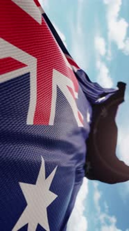 Realistic Australian Flag Waving in Wind Against Blue Sky