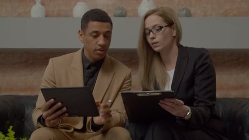 Diverse Multiracial Business Partners Analyzing Financial Data at Office