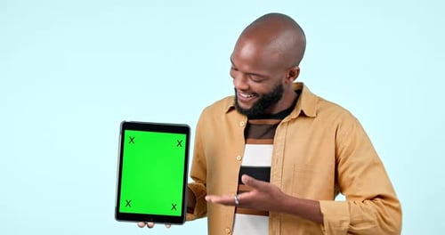 Man, tablet mock up and green screen in studio with website, internet and social network