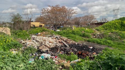 Urban pollution showing garbage dump and discarded waste
