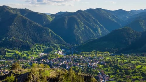 View From Rock to Town of Smolyan with Meadows for Cattle Walking and Houses Between Mountain Range