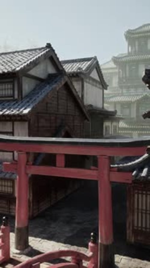A Red Gate in Front of a Row of Buildings