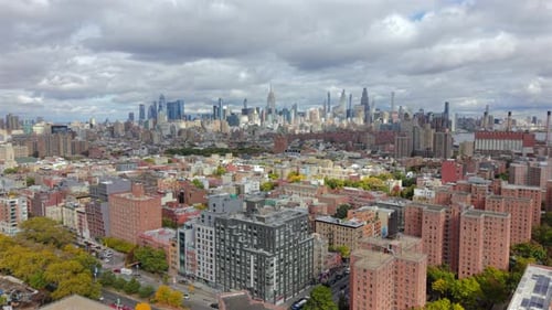 Expansive Aerial View of New York City Skyline Above Dense Residential Buildings