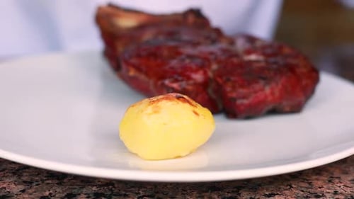 Juicy Steak and Potatoes on White Plate