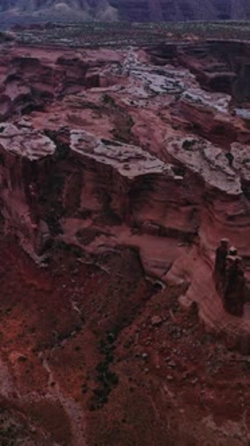 Curvy lines of rocks in the amazing canyon. Car road going through the territory between the rocks.