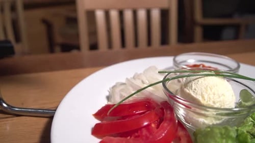 Slow revealing shot of vegetable hors d'oeuvres served in a restaurant