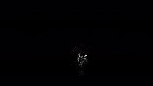 Abyss Collection: A black ball falling in the water from above and spreading very small splashes ove