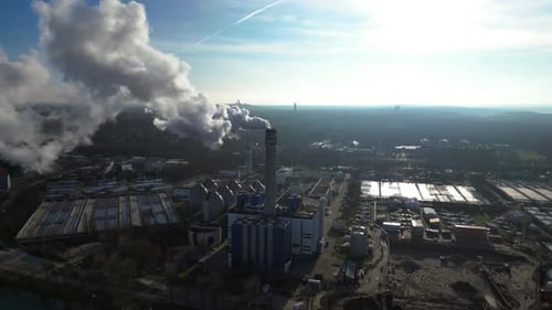 Waste energy plant factory with smoke chimney. Fantastic aerial view flight drone