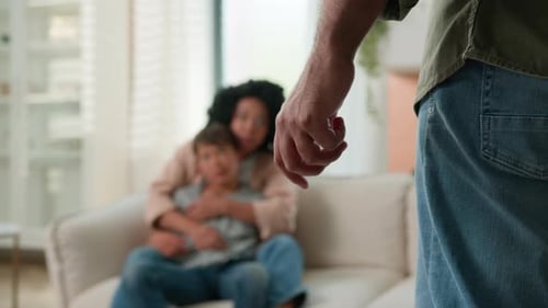 Man's Clenched Fist with Mother and Child