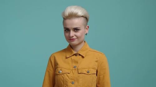 Smiling Woman with Blonde Hair and Yellow Jacket