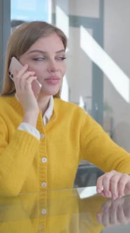 Smiling Woman Chats on Cell Phone