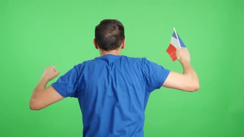 Rear View of a Man Waving a French Pennant