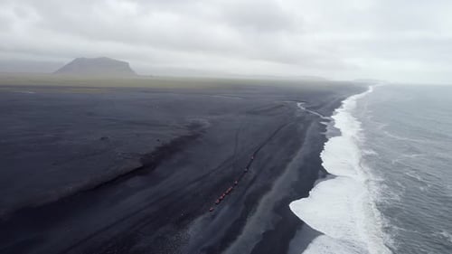 Flying along Iceland's endless black sand beach in Solheimfjara