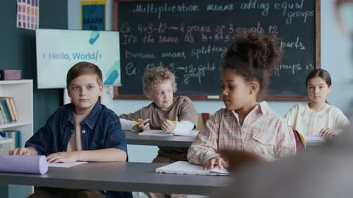 Teacher Interacting with Students During Classroom Lesson