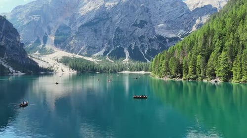 Tourists enjoying boat trip on beautiful mountain lake