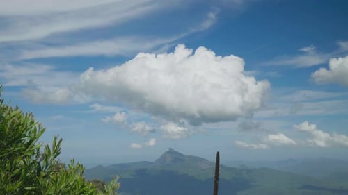 Big cloud in sky above mountain