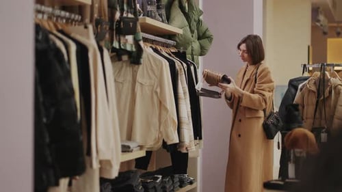 Young Successful Businesswoman Shopping In Trendy Store Of Clothes And Accessories In Shopping Mall
