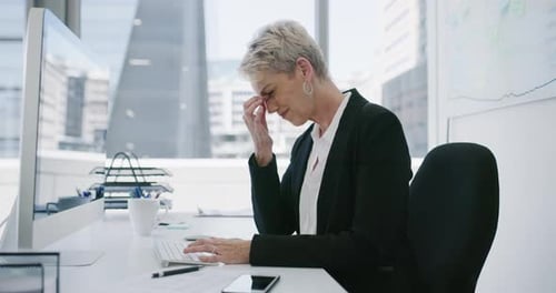Woman working at computer in modern office